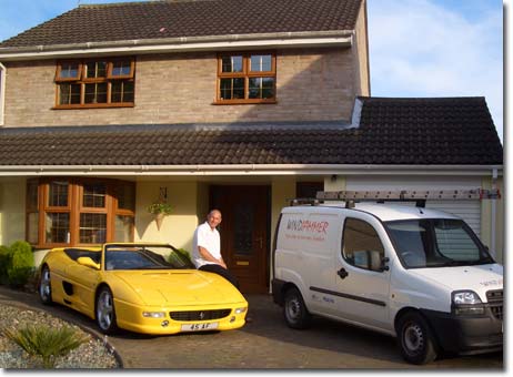 Andy Fletcher the Managing Director of WindJammer UK Ltd with his prized Ferrari attributed to sales from Comfortable Conservatories!